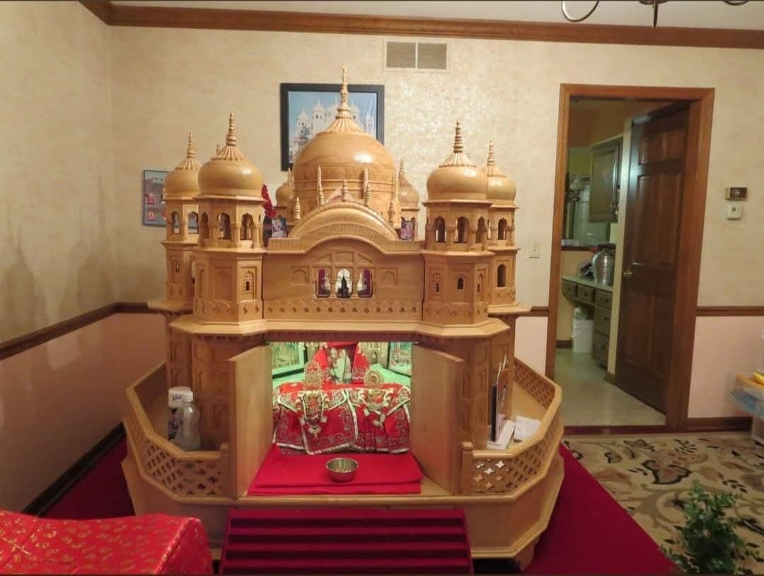 Wall-mounted wooden puja mandir
