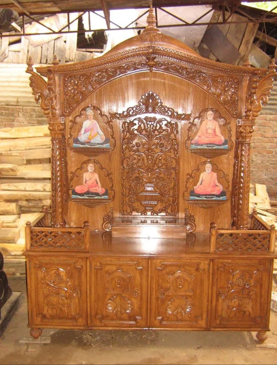 Wooden mandir with tiered shelves for idols