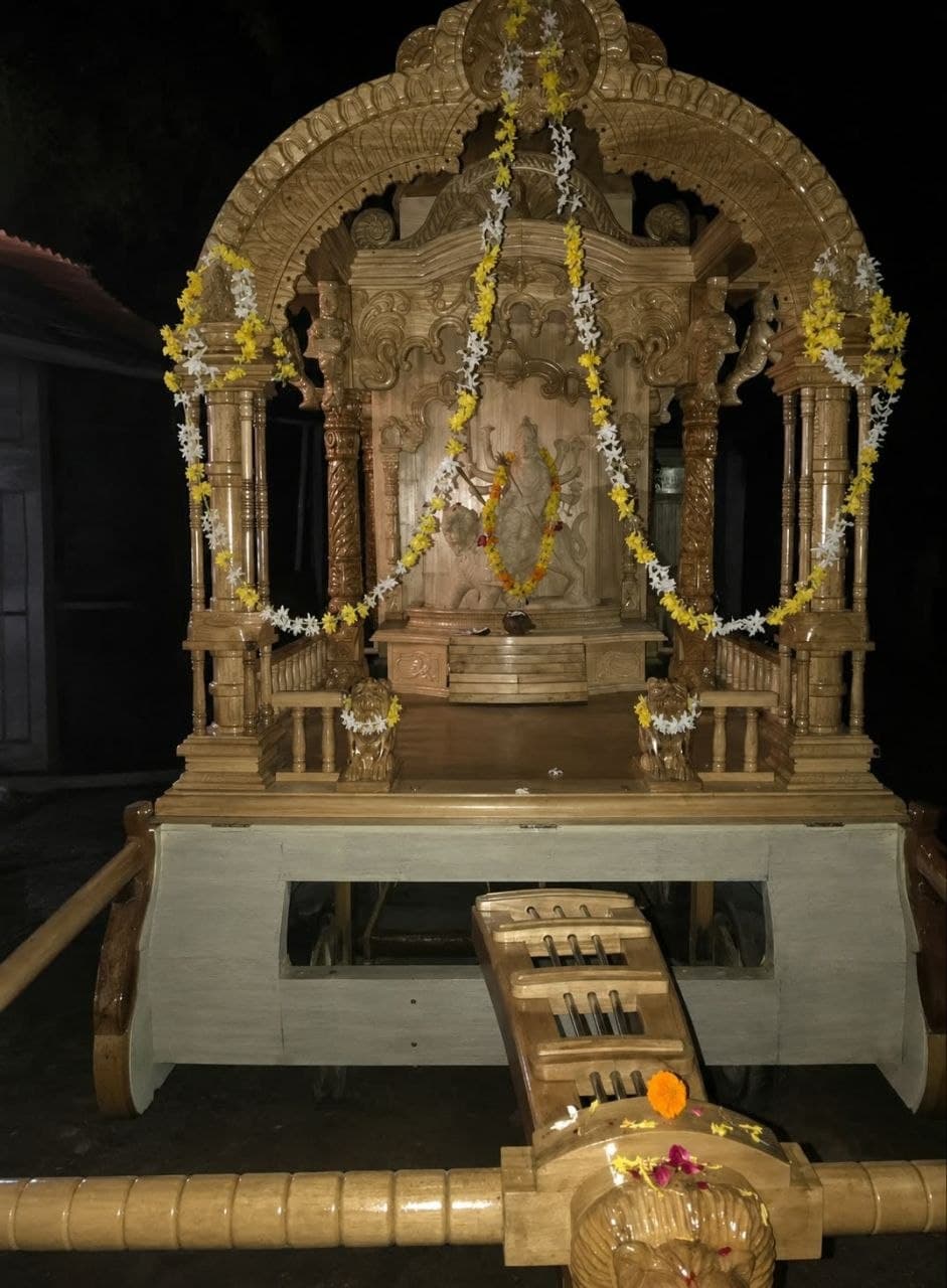 Hand-carved wooden chariot-style temple mandir with domed canopy